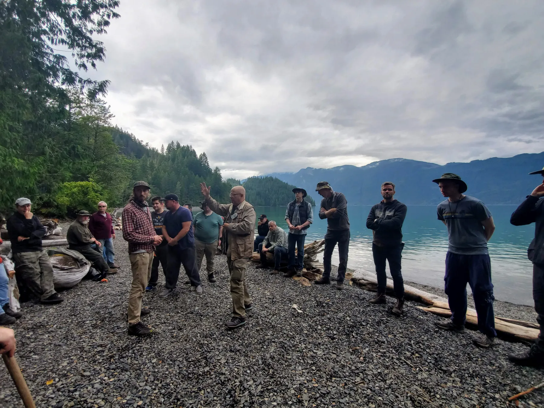 The production men in a line at the lakeshore